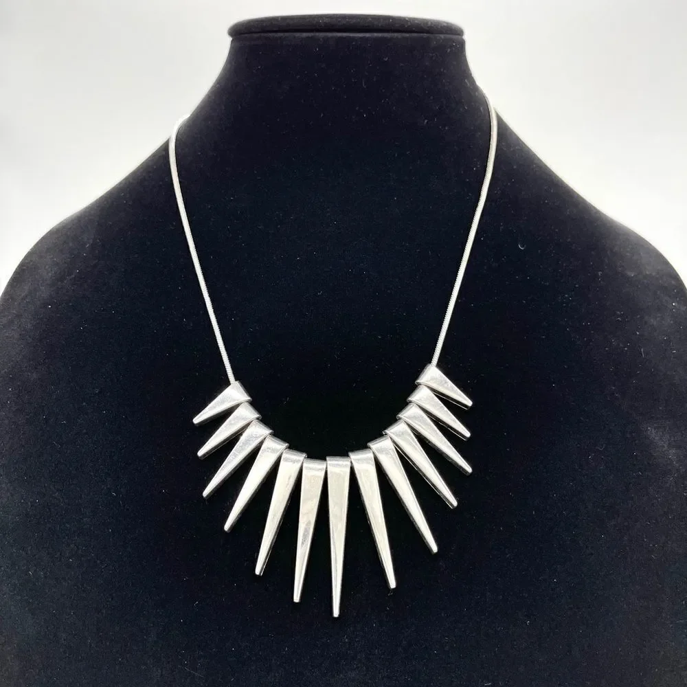 -Express Silver tone chain w/ triangle accents